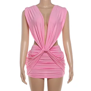 Close-up detail view of the pink pleated bodycon dress featuring a sexy deep V-neckline