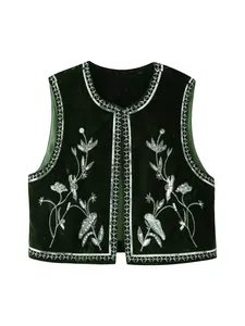 Elegante donkergroene fluwelen gilet met zilveren bloemenborduurwerk en open voorkant.