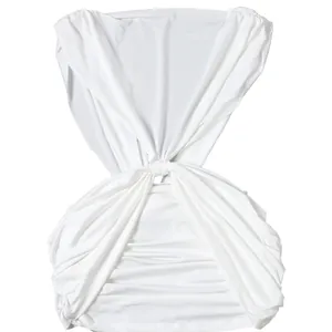 Close-up of white ruched bodycon dress showing deep V-neck and twisted waist detail