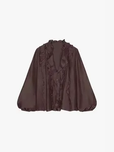 Elegant dark brown V-neck ruffle blouse with puff sleeves in a sophisticated French style.