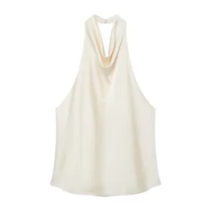 Detailed view of champagne silk satin halter top featuring an elegant draped cowl neckline