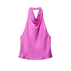 Close-up detail of a pink satin halter-neck backless top showing smooth silk-like texture