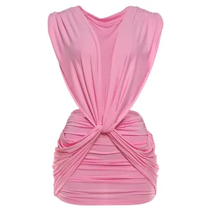 Close-up of pink deep V-neck ruched dress with twist front detail and bodycon fit