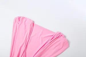 Macro view showing the deep V-neckline and elegant ruched details of this pink dress.
