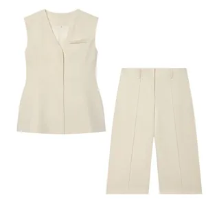 Detail view of cream V-neck vest and wide-leg shorts set with hidden buttons