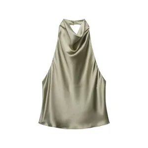 Detailed view of champagne satin halter top featuring a cowl neck and back button closure