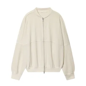Detailed view of a cream oversized zip-up sweatshirt jacket with minimalist design