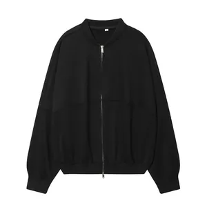 Front view of an oversized black zip-up bomber jacket with dropped shoulder seams