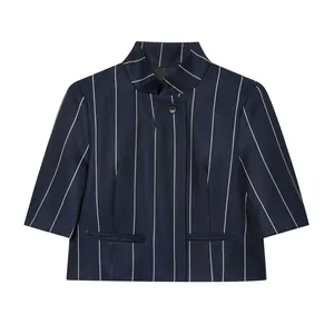 Close-up of navy blue striped cropped jacket with standing collar and welt pockets