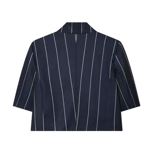 Back view of a navy blue pinstripe cropped blazer with professional tailoring detail.