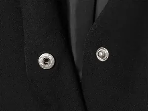 Close-up view of the hidden metal snap button closure on a premium black suit vest.