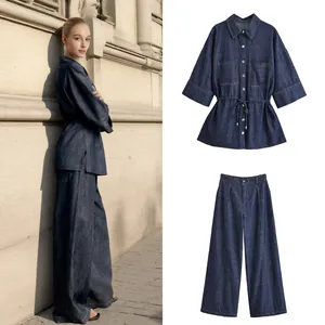 Chic deep blue denim coordinate set with a tie-waist lapel shirt and wide-leg trousers.