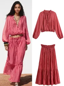 Detail view of pink two-piece set with pleated texture and elasticated waist.