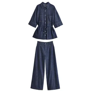 Two-piece dark denim set featuring tie-waist shirt and elegant wide-leg trousers