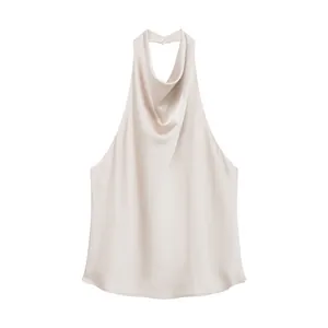 Close-up detail of an elegant champagne silk satin halter neck backless top for women