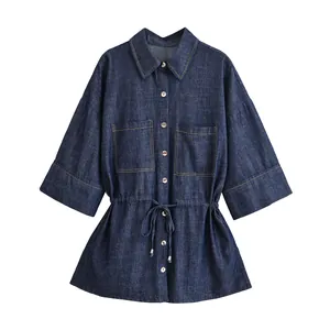 Dark blue denim shirt with drawstring waist and chest pockets on white background