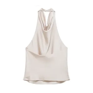 Elegant champagne satin halter top detail featuring a draped cowl neck and backless design
