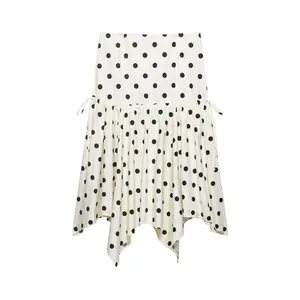 Falda midi chic con lunares blancos y negros, dobladillo asimétrico y cordón lateral