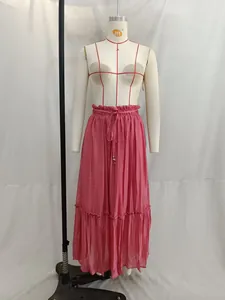 Professional studio display of a stylish pink pleated tiered maxi skirt on a mannequin