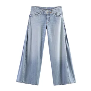 Detail of light blue wide-leg denim jeans with unique side split design for women