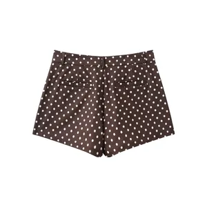 Detailed back view of brown seersucker shorts with classic white polka dot pattern