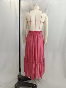 Detailed back view of pink pleated maxi skirt on mannequin with elastic waist detail