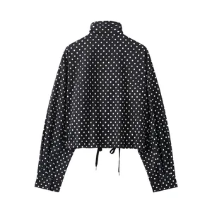Back view of a black and white polka dot seersucker jacket with drawstring hem detail