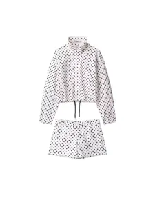 Women's two-piece polka dot seersucker jacket and shorts set on white background