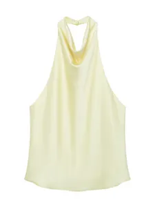 Elegant light yellow silk satin halter neck backless top in a professional flat lay view