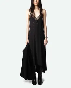 Detail view of black rhinestone spaghetti strap dress with lace trim and high-low hem