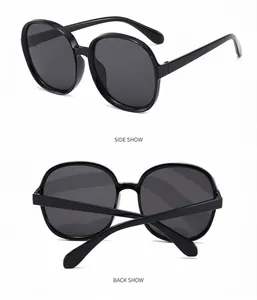 Detail view showing side and back angles of vintage black oversized round sunglasses