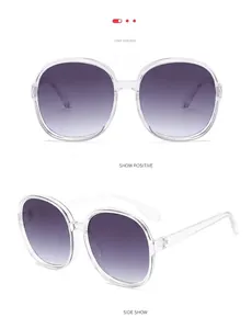 Detailed views of vintage oversized sunglasses with transparent frame and gradient grey lenses