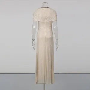 Back view of an elegant slim-fit maxi dress with a cape-style overlay and rhinestones