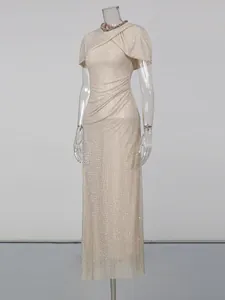Elegant champagne rhinestone maxi dress with cape sleeves and jeweled collar detail.