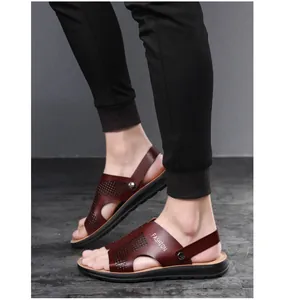 Macro view of men's breathable brown PU leather sandals featuring hollow design details