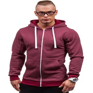 Detail view of a premium men's burgundy zip-up hoodie featuring white drawstrings