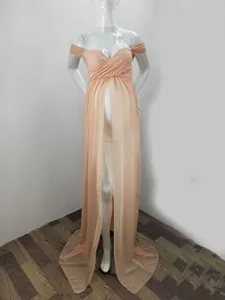 Elegant peach lace maternity photoshoot gown with off-shoulder neckline and front slit