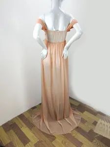 Back view of elegant peach off-shoulder maternity photoshoot gown with delicate lace detail