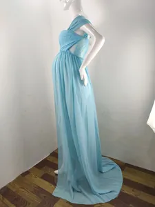 Side view of a light blue maternity photography dress with lace bodice and trailing chiffon skirt.