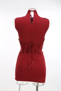 Close-up of back lace-up corset detail on red bodycon sleeveless dress.