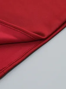 Close-up of high-quality red fabric and durable stitching on a sexy bodycon dress