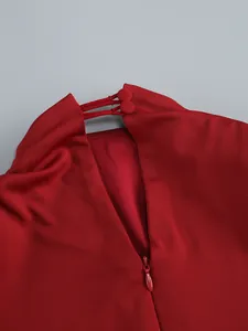 Detailed view of the red banquet dress neckline with buttons and hidden zipper