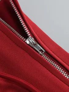 Macro view showing the high-quality silver metal zipper on this red banquet dress