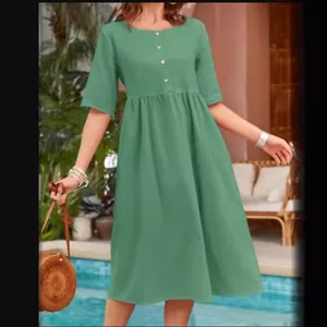 Casual green cotton linen midi dress with crew neck and short sleeves for summer