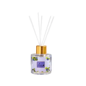 Elegant reed diffuser set with transparent glass bottle and golden cap for home fragrance