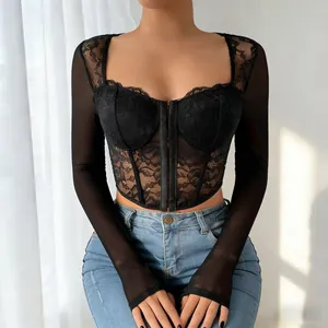 Close-up detail of sexy black lace mesh top with square neck and corset boning