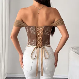 Vue détaillée du dos d'un corset vintage en jacquard avec fermeture à lacets et ruban