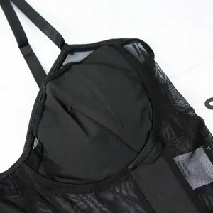 Detailed view of sexy black mesh patchwork bodysuit featuring built-in padded cups and straps