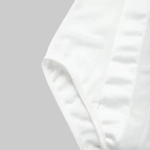 Macro view of white sheer mesh fabric and fine stitching on a slim-fit bodysuit.