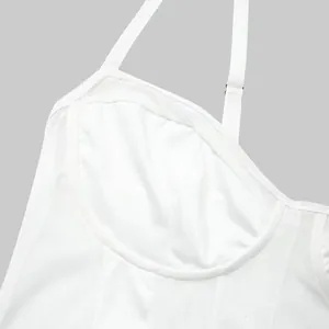 Close-up of white mesh bodysuit showing detailed stitching and adjustable strap.
